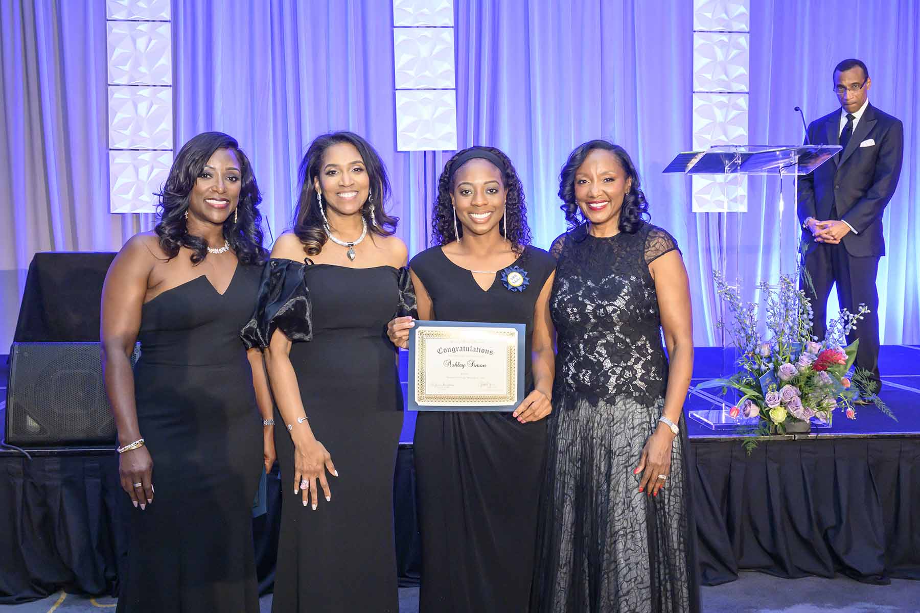 2025 SHB Scholarship Recipient Ashley Simon and Ball Chairs