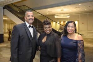 Past 2022 Barristers Ball Honoree Alaina King Benford, her husband, Leo Benford, and guest